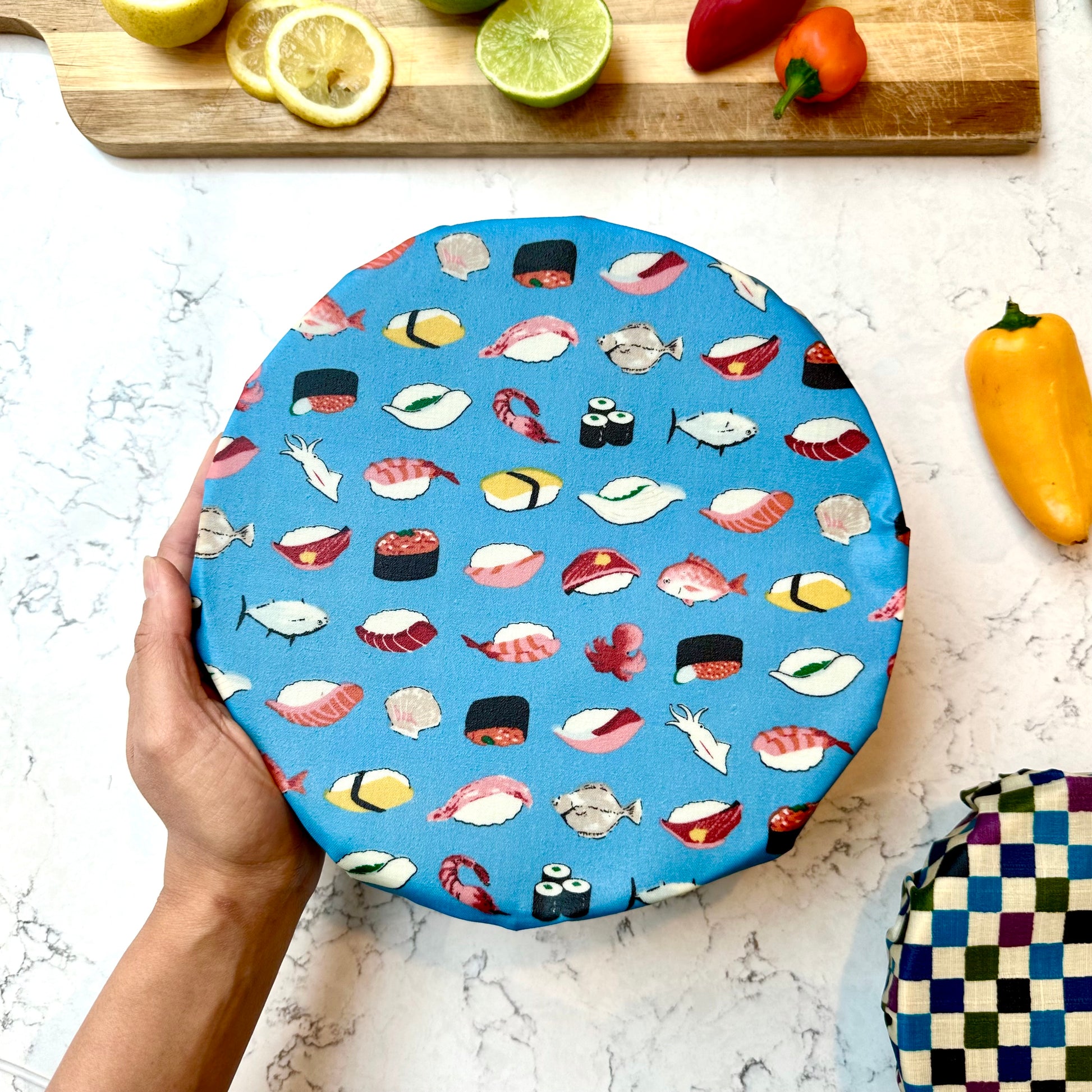 Beeswax good wraps with Sushi prints, Wrap covering a bowl to keep food fresh, eco friendly alternative to plastic film